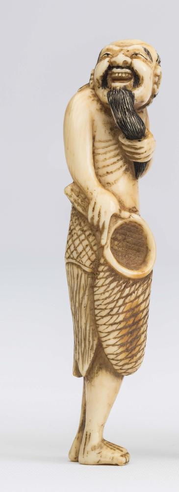 A JAPANESE IVORY NETSUKE Image