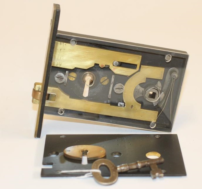 A CHARLES SMITH BRASS AND IRON HORIZONTAL ASYLUM LOCK Image