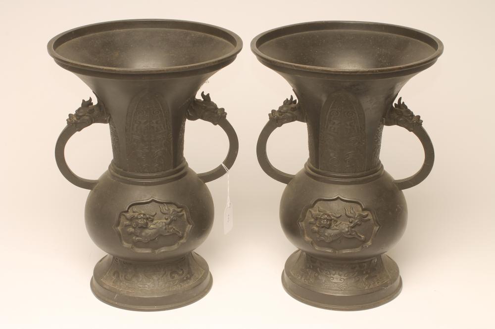 A PAIR OF CHINESE BRONZE VASES of baluster form with high everted necks Image