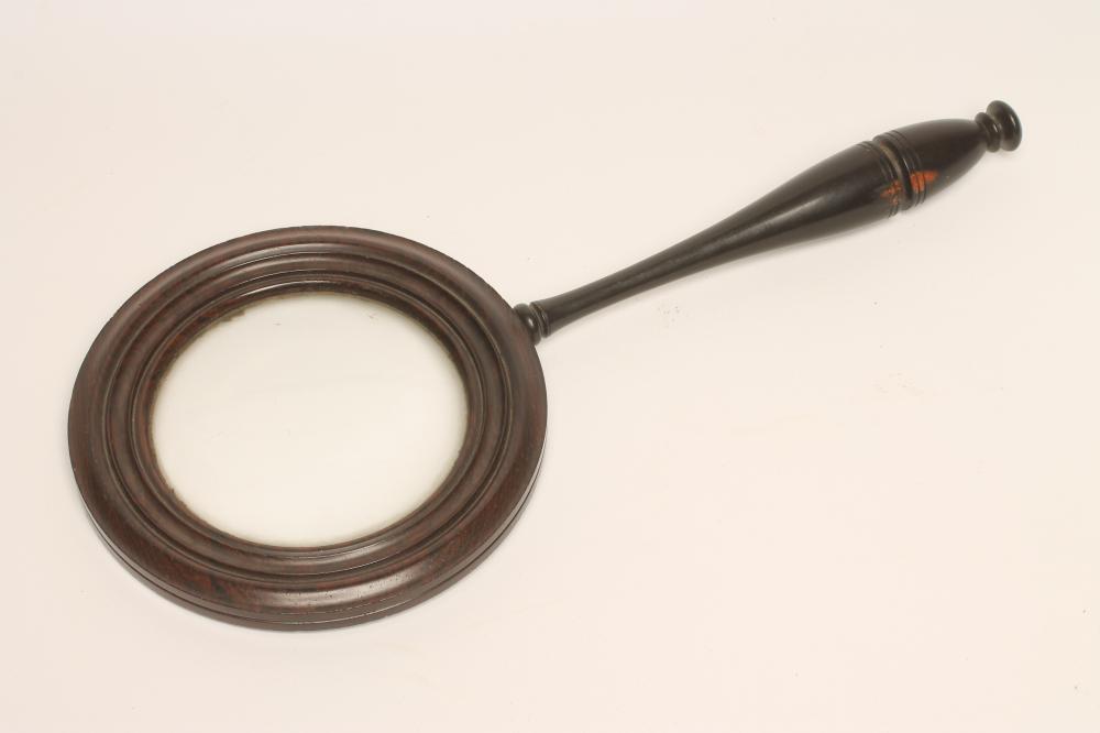 A ROSEWOOD FRAMED MAGNIFYING LENS Image