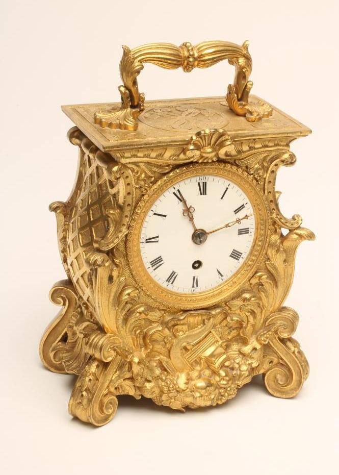AN ENGLISH ORMOLU CASED MANTEL CLOCK Image