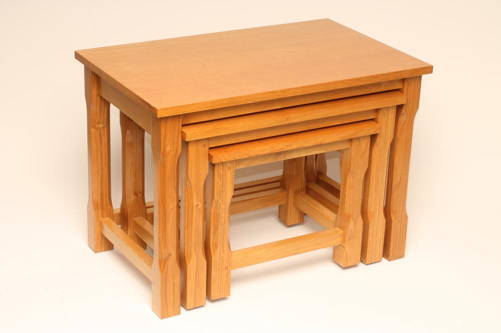 AN OAK NEST OF THREE TABLES by Coxwold Cabinetmakers Image