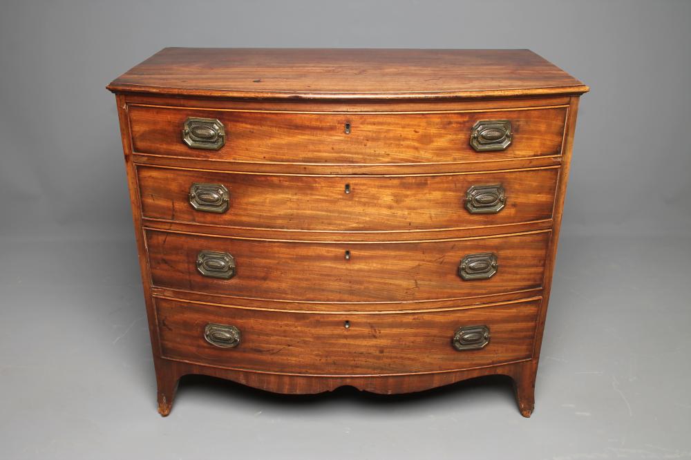 A REGENCY MAHOGANY CHEST of bowed form Image