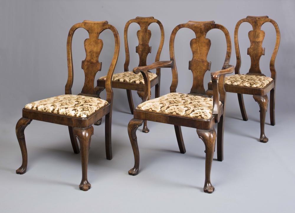 A SET OF EIGHT WALNUT DINING CHAIRS including two elbow chairs Image
