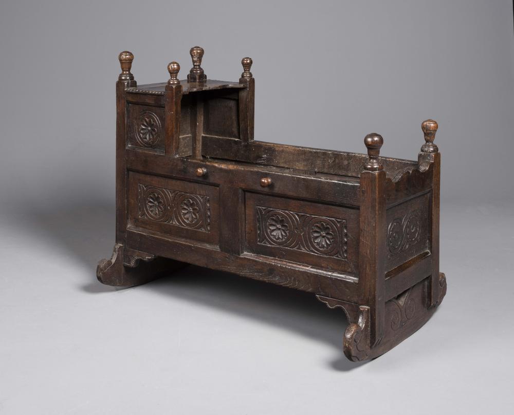 A JOINED OAK PANELLED CRIB Image