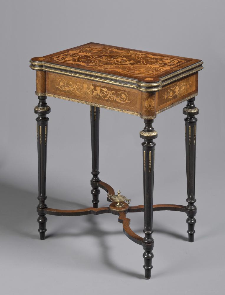 A LOUIS XVI STYLE KINGWOOD AND EBONISED FOLDING GAMES TABLE Image