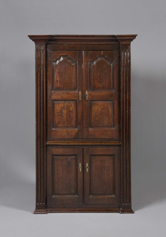 A GEORGIAN OAK STANDING CORNER CUPBOARD Image