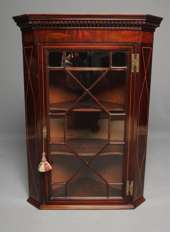 A GEORGIAN MAHOGANY AND STRING INLAID CORNER CUPBOARD Image