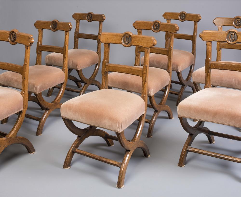 A SET OF EIGHT GOTHIC OAK RAIL BACK DINING CHAIRS in the manner of A.W.N. Pugin Image