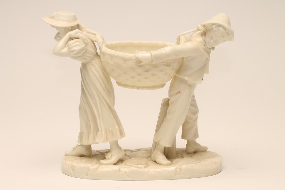 JAMES HADLEY FOR ROYAL WORCESTER- A CHINA FIGURAL FLOWER HOLDER Image