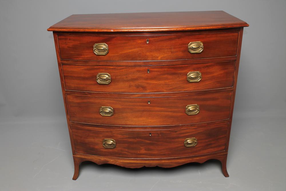 A REGENCY MAHOGANY CHEST of bowed form Image