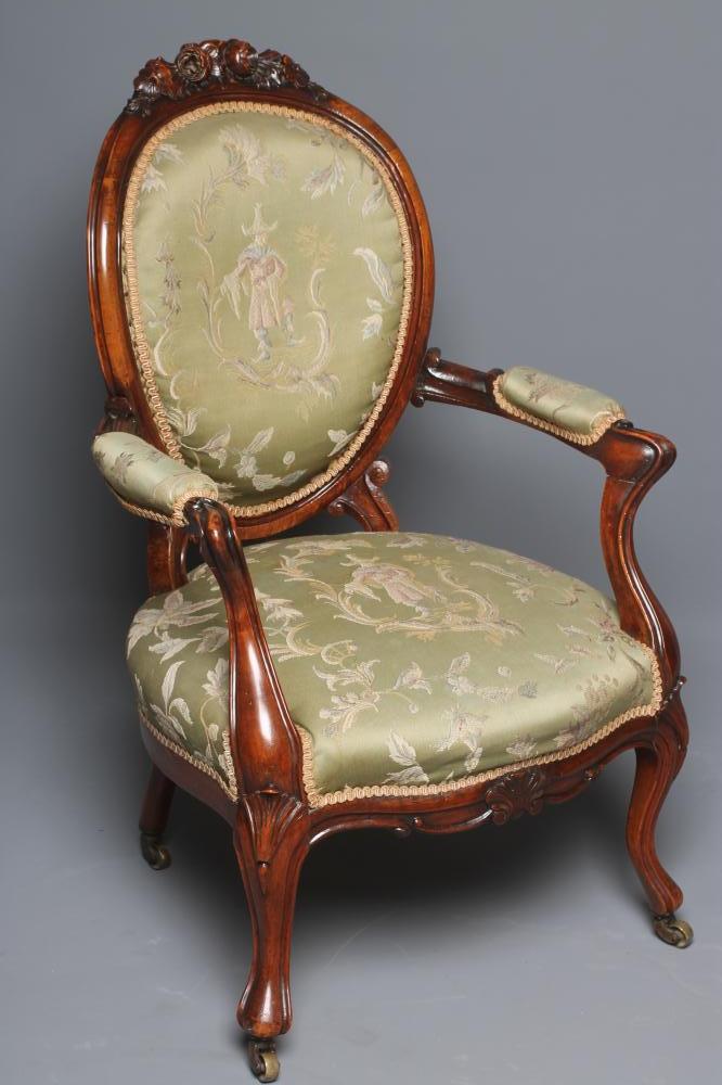 A VICTORIAN WALNUT FRAMED SALON CHAIR of balloon back form upholstered in green silk chinoiserie Image