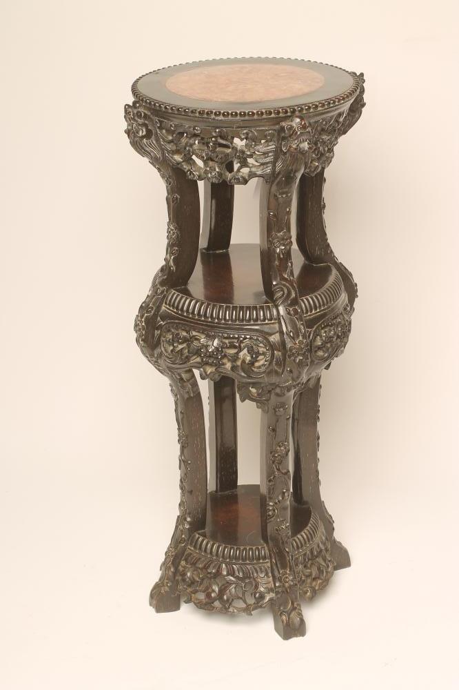 A CHINESE PADOUK WOOD JARDINIERE STAND of circular three tier form Image
