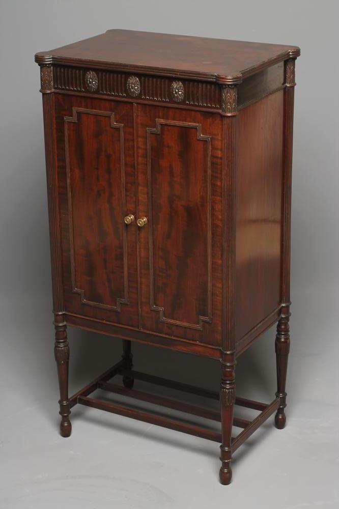A GEORGIAN REVIVAL MAHOGANY MUSIC CABINET Image