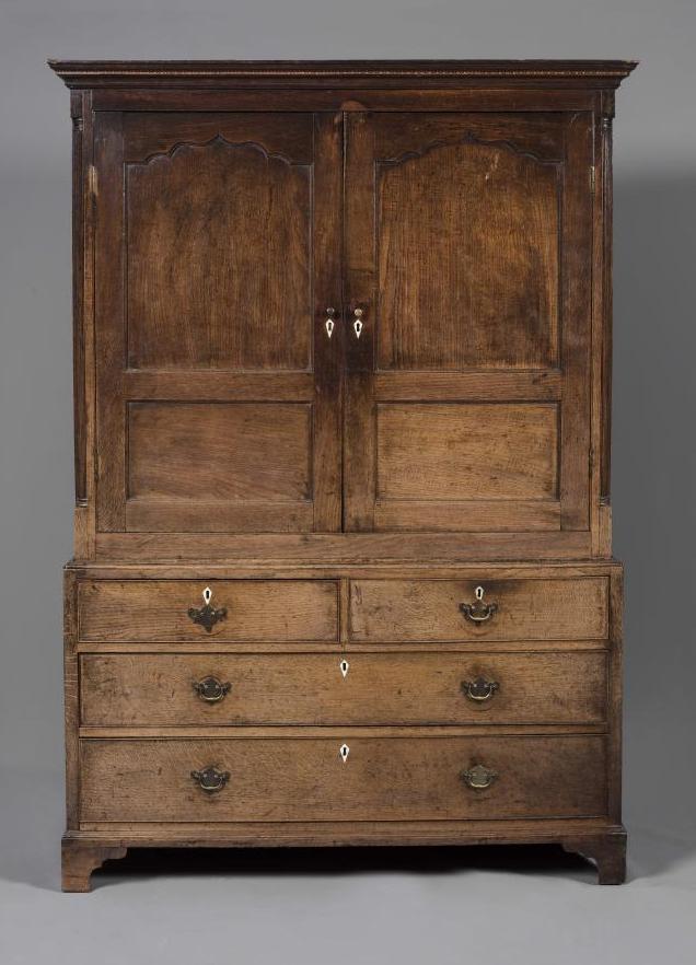 A GEORGIAN OAK CUPBOARD ON CHEST Image