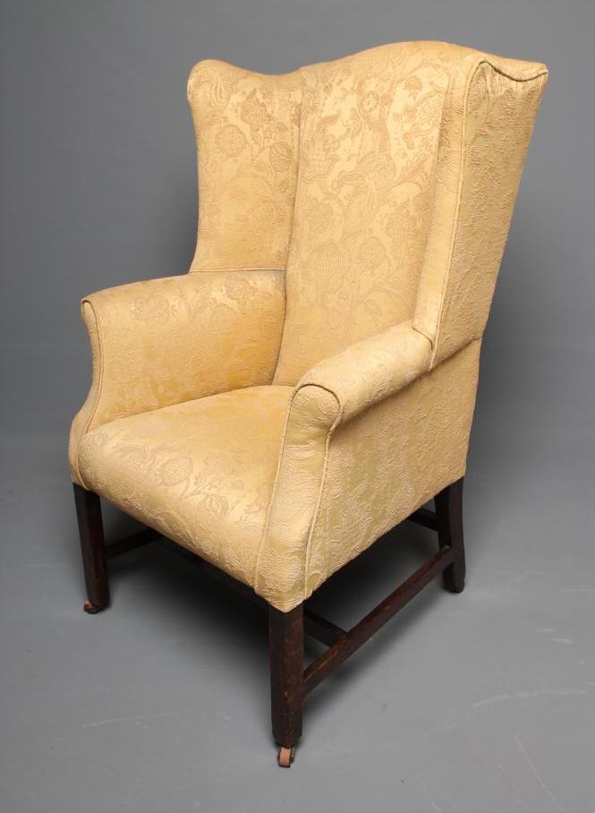 A GEORGIAN OAK FRAMED WING ARMCHAIR Image
