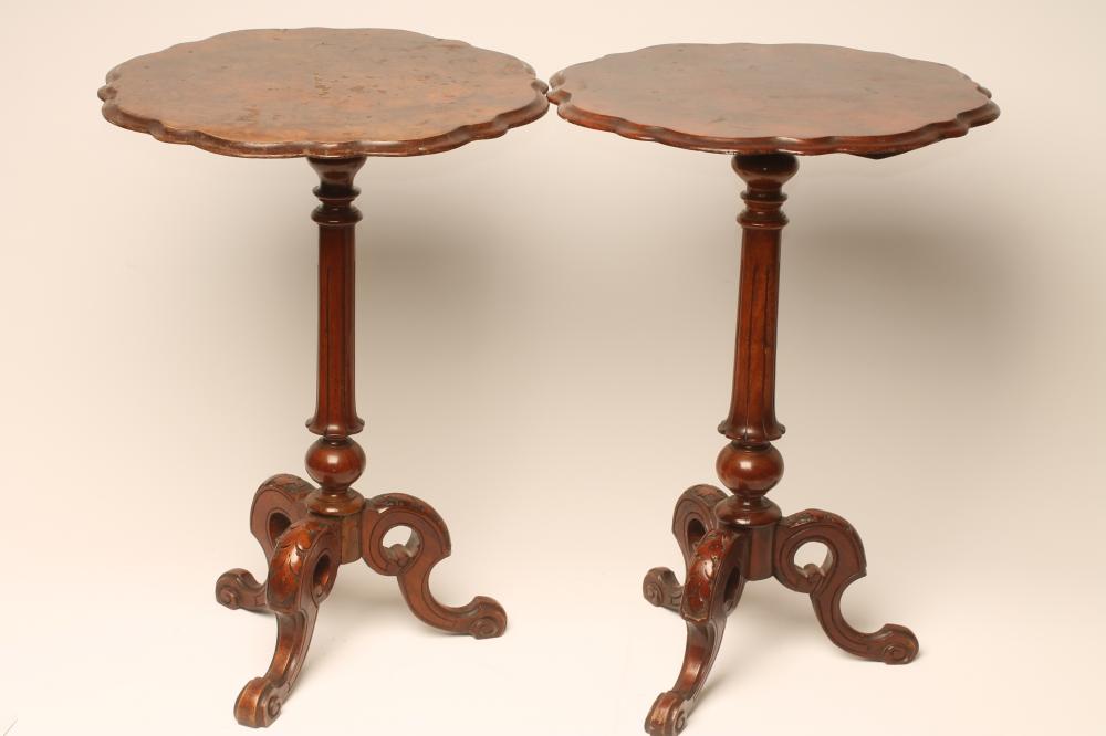 A PAIR OF VICTORIAN WALNUT TRIPOD TABLES Image