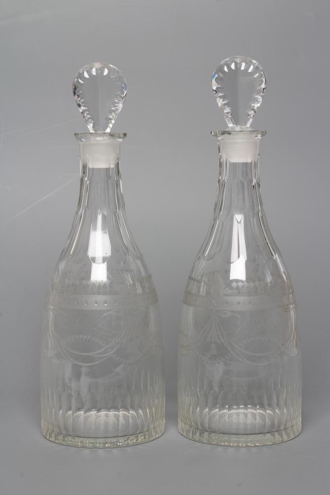 A PAIR OF GEORGIAN GLASS TAPERING DECANTERS with printe cut lozenge stoppers Image