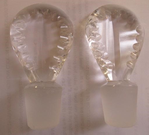 A PAIR OF GEORGIAN GLASS TAPERING DECANTERS with printe cut lozenge stoppers Image