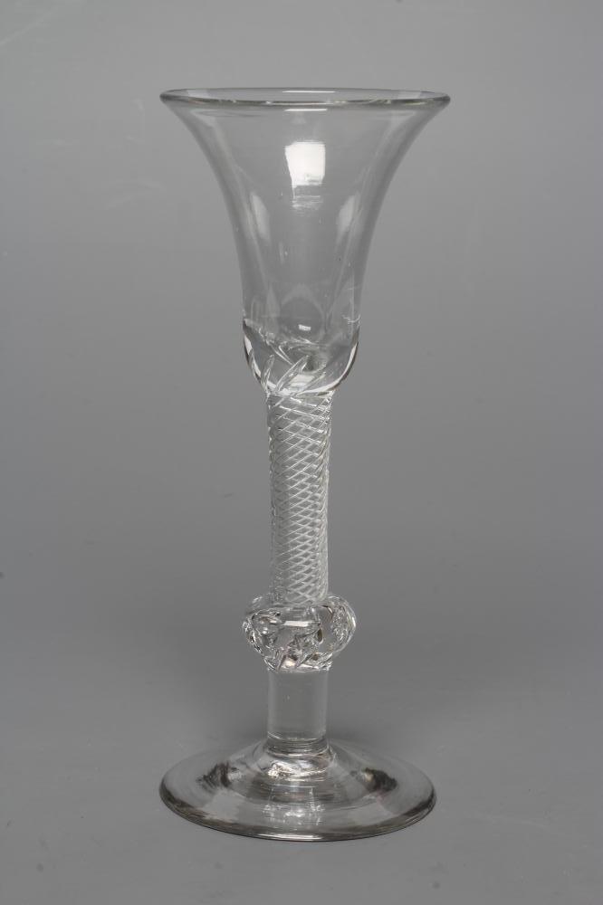 A WINE GLASS, mid 18th century, the bell bowl on a composite multiple spiral air twist stem with Image