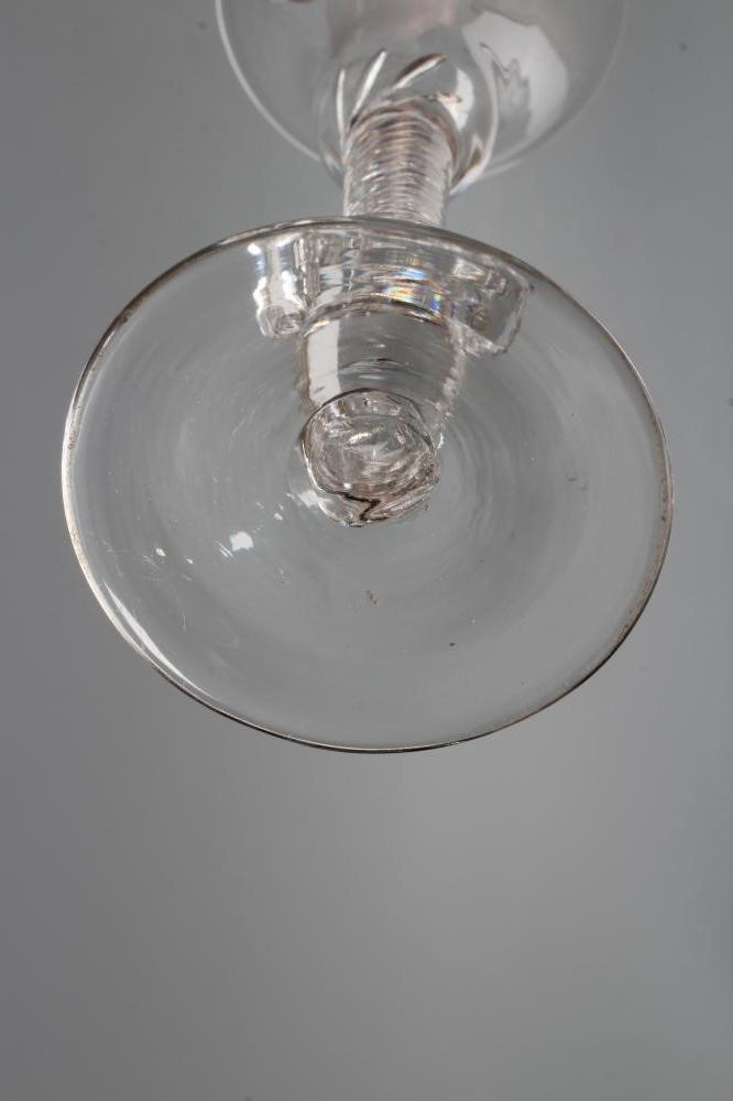 A WINE GLASS, mid 18th century, the bell bowl on a composite multiple spiral air twist stem with Image