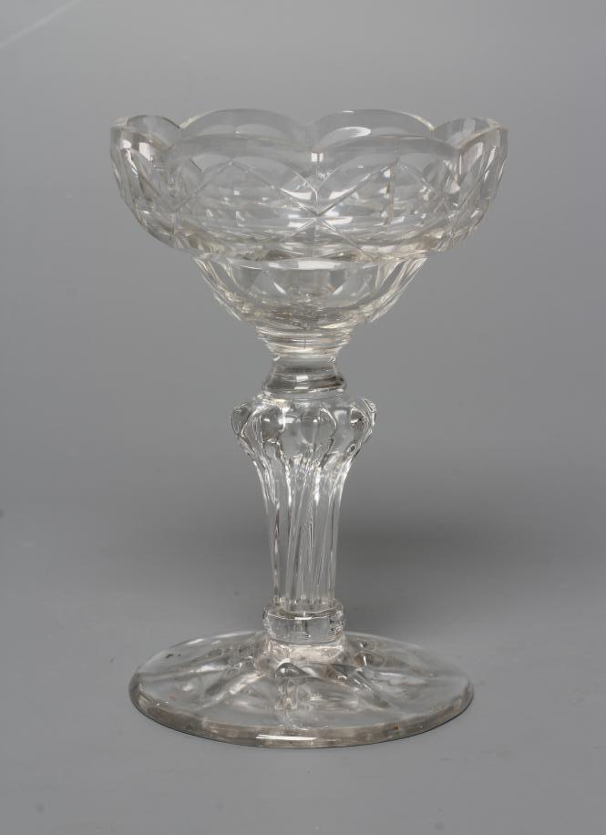 A GLASS SWEETMEAT, late 18th century, the double ogee bowl with panel cutting on a wrythen moulded Image