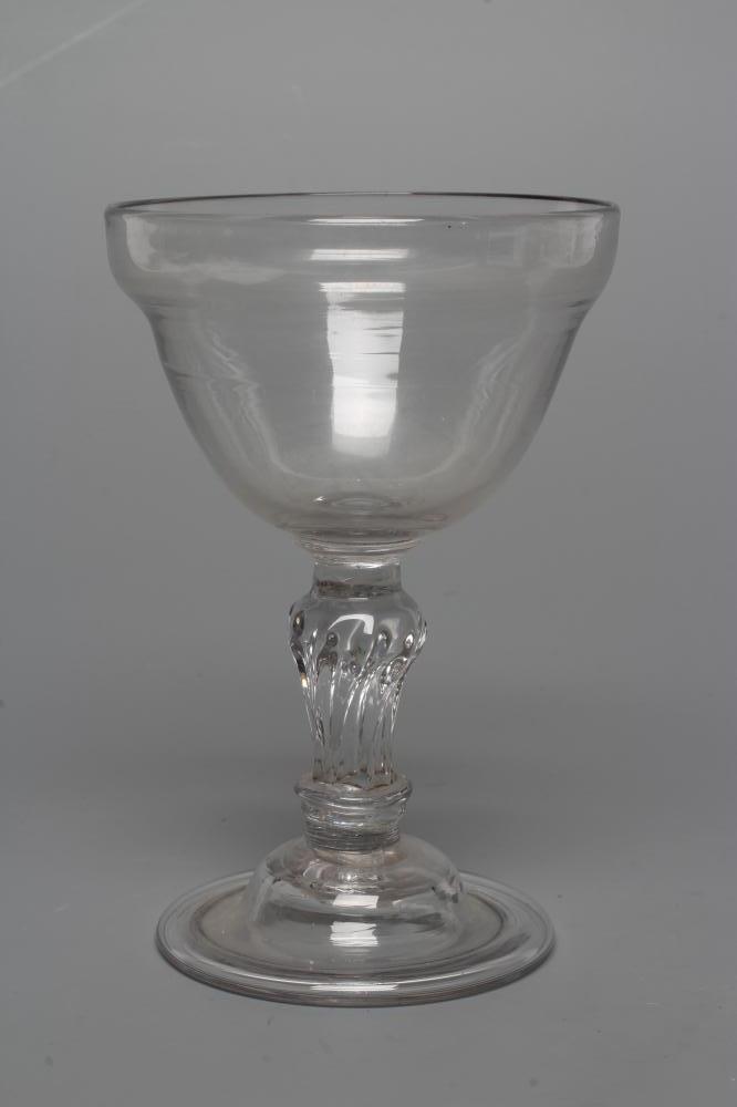 A GLASS GOBLET, late 18th century, the plain double ogee bowl on a wrythen moulded flared Image