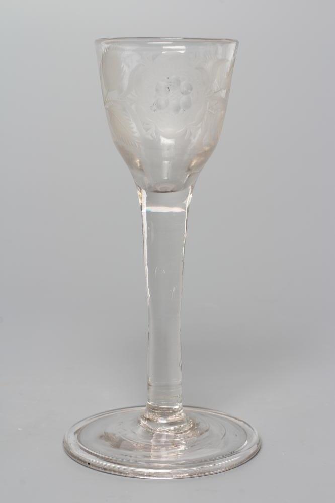 A JACOBITE CORDIAL GLASS, mid 18th century, the round funnel bowl engraved with a rose and two buds Image