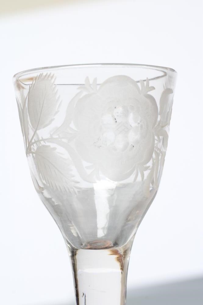 A JACOBITE CORDIAL GLASS, mid 18th century, the round funnel bowl engraved with a rose and two buds Image