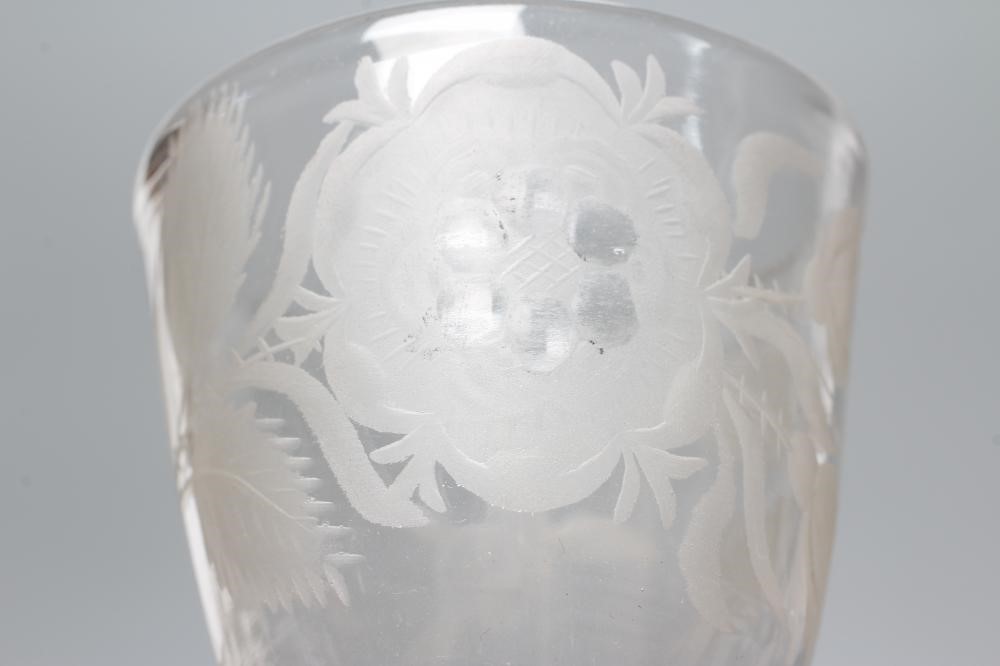 A JACOBITE CORDIAL GLASS, mid 18th century, the round funnel bowl engraved with a rose and two buds Image