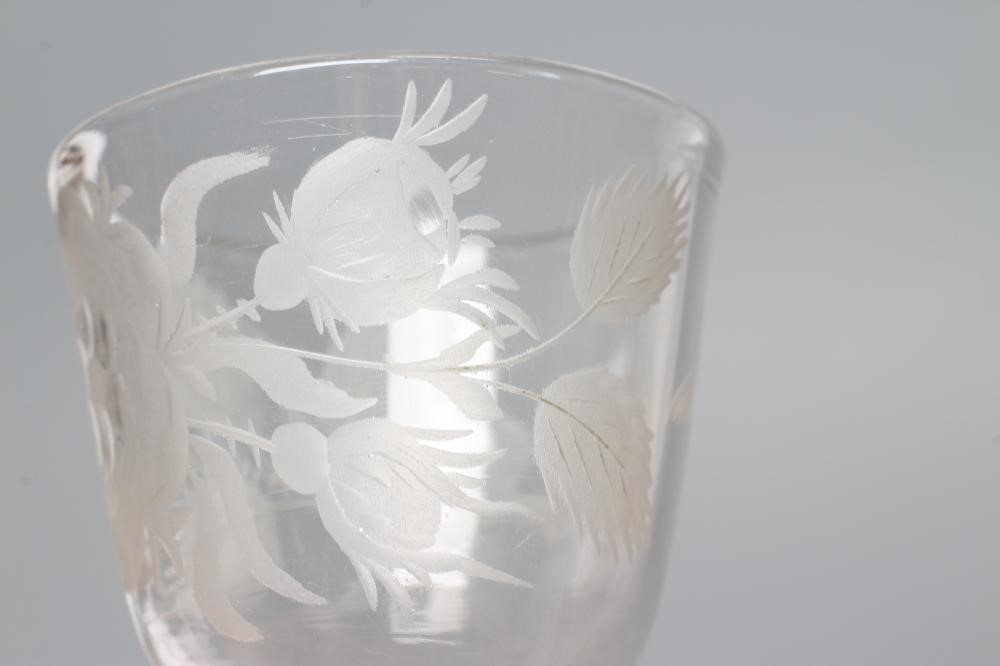 A JACOBITE CORDIAL GLASS, mid 18th century, the round funnel bowl engraved with a rose and two buds Image