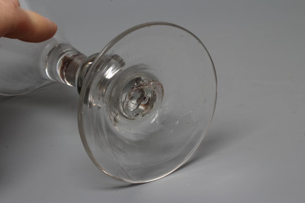 A WINE GLASS, mid 18th century, the drawn trumpet bowl on single knopped plain stem and conical Image