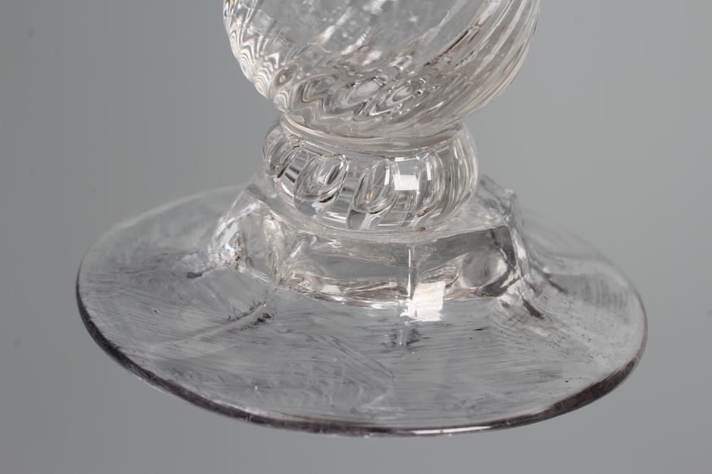A JELLY GLASS, mid 18th century, the wrythen moulded double ogee bowl on a teared knop and lobed Image