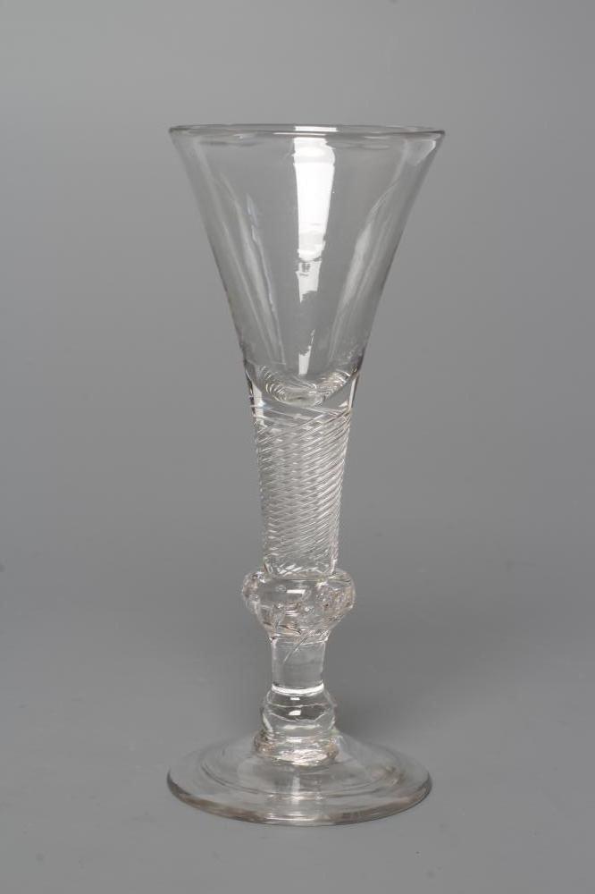 A WINE GLASS, mid 18th century, the drawn trumpet bowl on a multiple spiral air twist stem with Image
