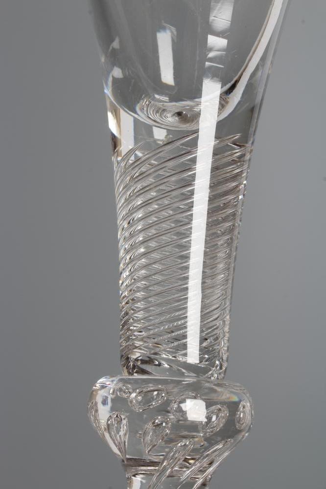 A WINE GLASS, mid 18th century, the drawn trumpet bowl on a multiple spiral air twist stem with Image