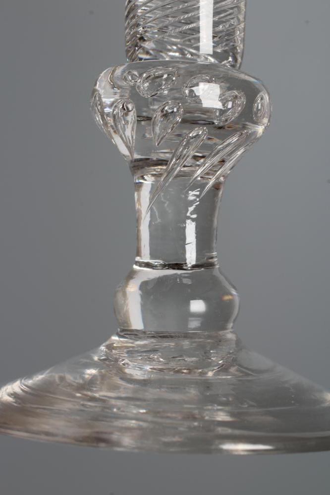 A WINE GLASS, mid 18th century, the drawn trumpet bowl on a multiple spiral air twist stem with Image