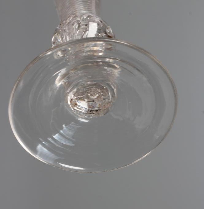 A WINE GLASS, mid 18th century, the drawn trumpet bowl on a multiple spiral air twist stem with Image