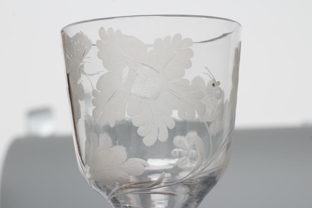 A JACOBITE WINE GLASS, mid 18th century, the ogee bowl engraved with oak leaves, a moth and other Image