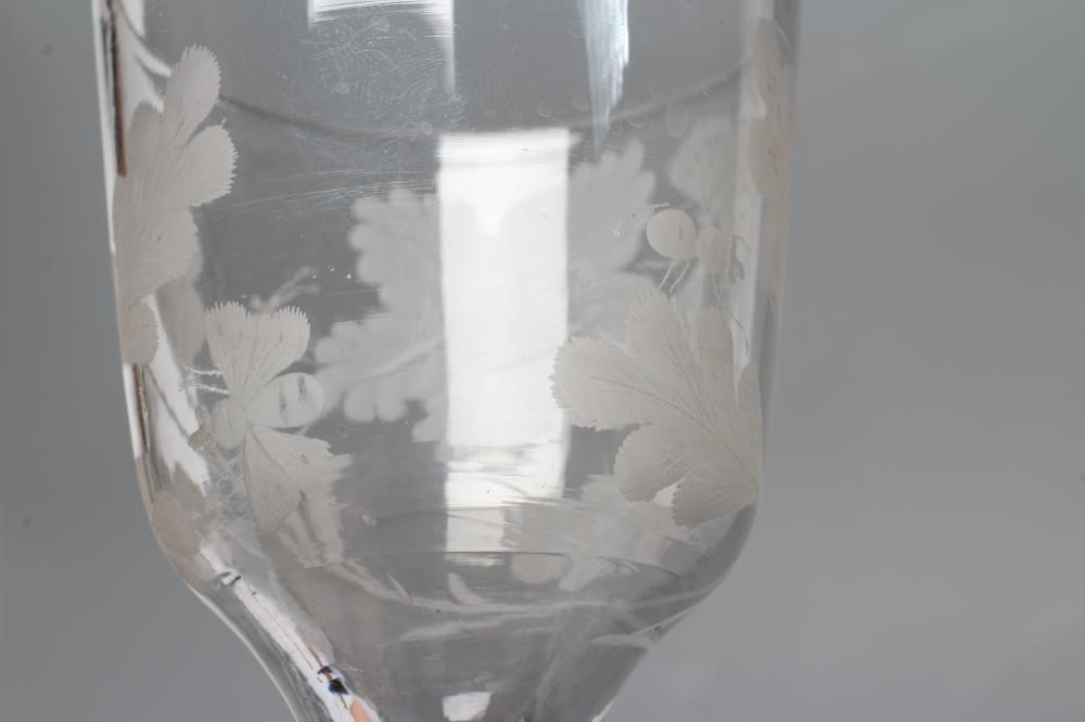 A JACOBITE WINE GLASS, mid 18th century, the ogee bowl engraved with oak leaves, a moth and other Image