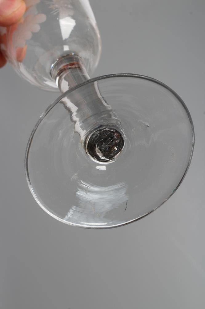 A JACOBITE WINE GLASS, mid 18th century, the ogee bowl engraved with oak leaves, a moth and other Image