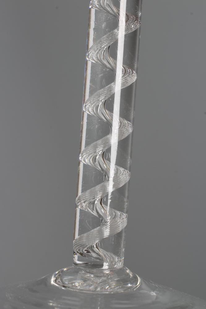 A CORDIAL GLASS, mid 18th century, the plain round funnel bowl on a simple single series air twist Image