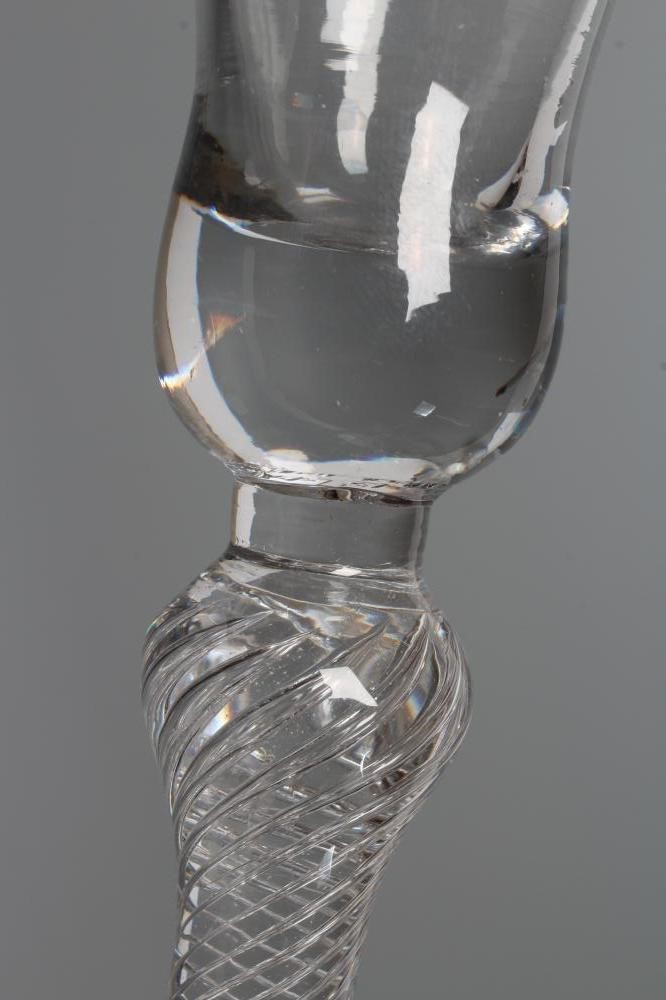 A WINE GLASS, mid 18th century, the bell bowl issuing from an inverted baluster multiple spiral air Image