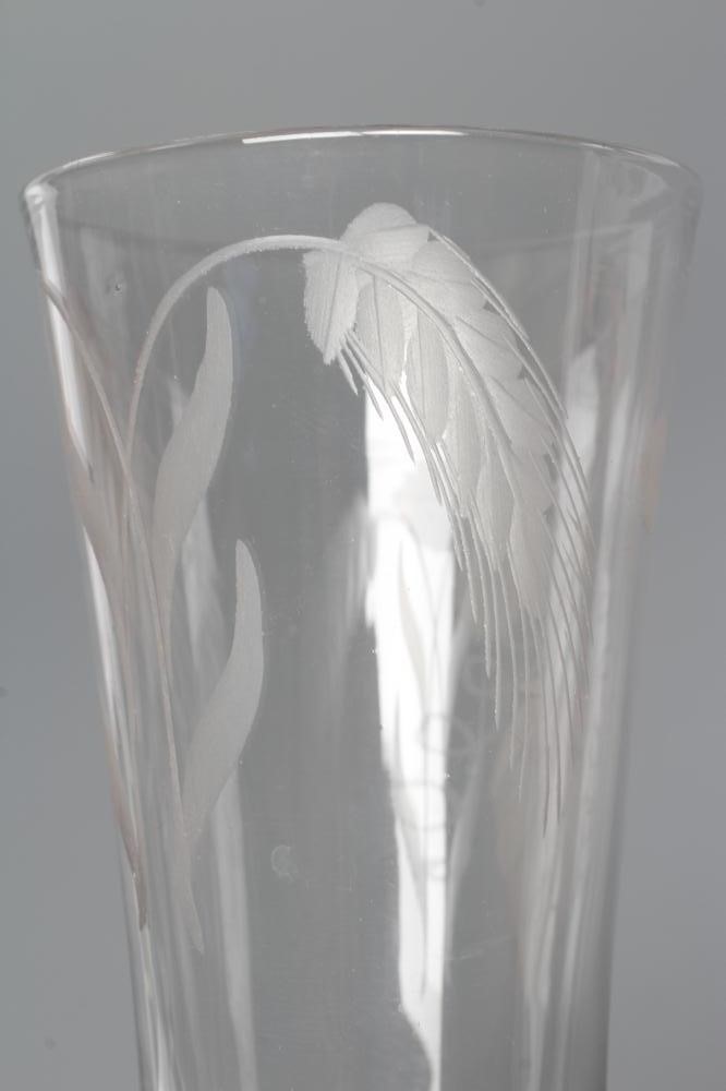 A GLASS ALE FLUTE, mid 18th century, the round funnel bowl engraved with hops and barley on a multi Image