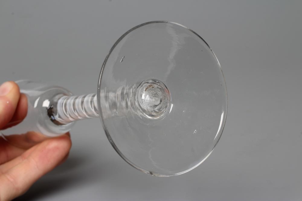 A CORDIAL GLASS, mid 18th century, the plain round funnel bowl issuing from multi-ply spiral twist Image