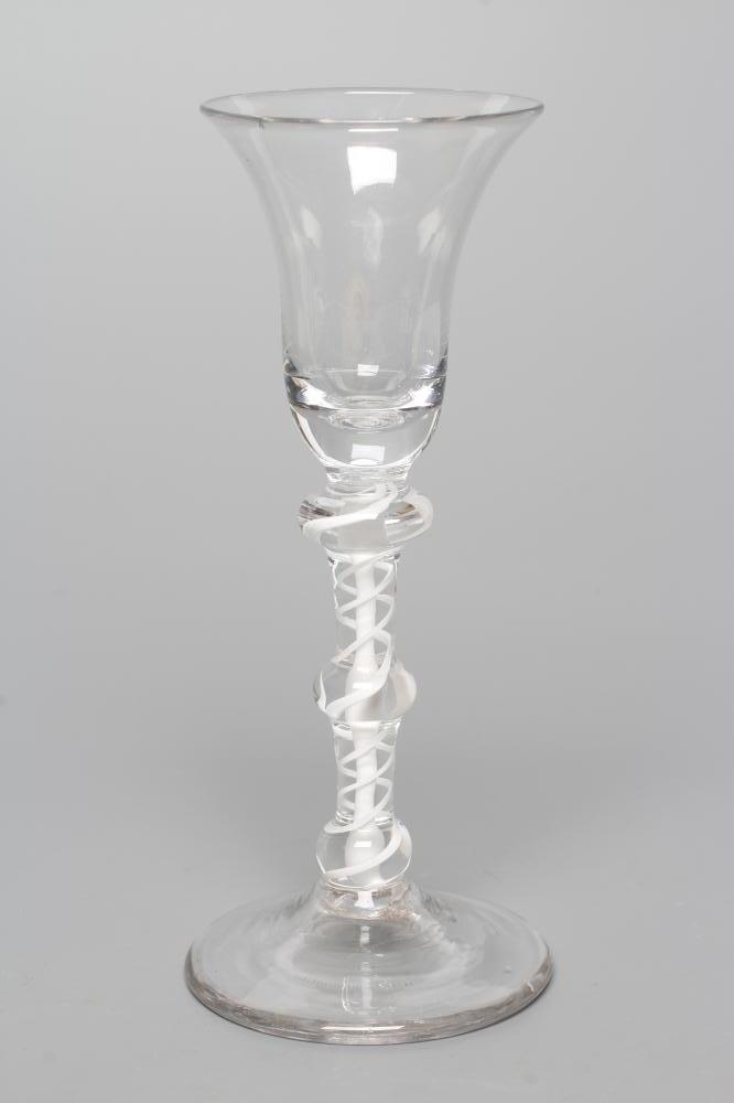 A WINE GLASS, mid 18th century, the plain bell bowl on a double series opaque twist stem with three Image