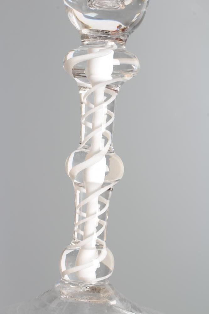 A WINE GLASS, mid 18th century, the plain bell bowl on a double series opaque twist stem with three Image