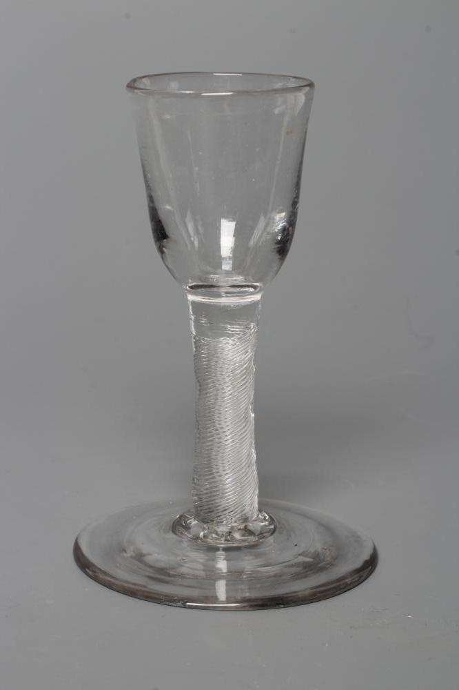 A MINIATURE CORDIAL GLASS, mid 18th century, the round funnel bowl on a plain cylindrical multiple Image