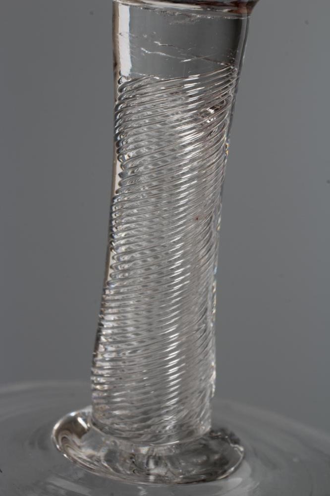 A MINIATURE CORDIAL GLASS, mid 18th century, the round funnel bowl on a plain cylindrical multiple Image