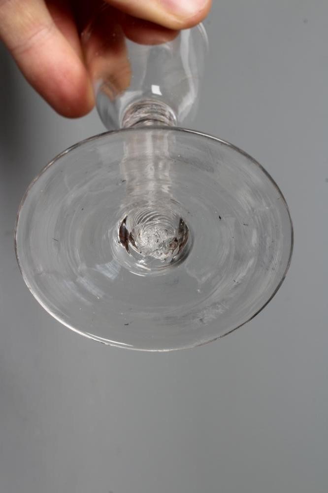 A MINIATURE CORDIAL GLASS, mid 18th century, the round funnel bowl on a plain cylindrical multiple Image