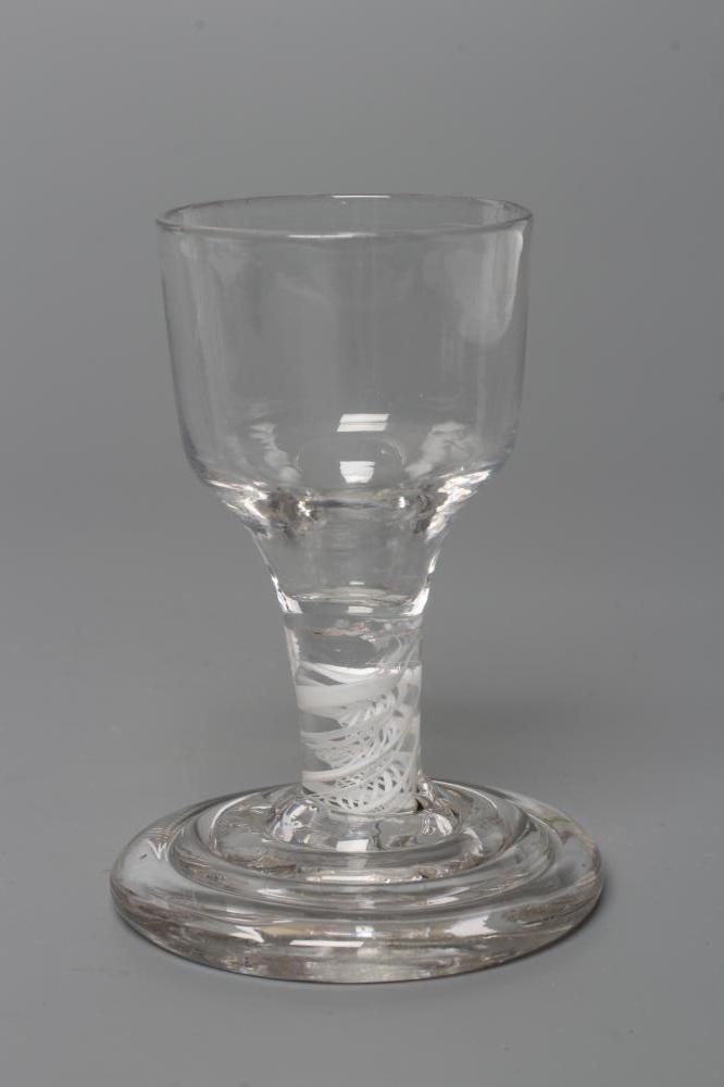A FIRING GLASS, mid 18th century, the ogee bowl on a short double series opaque twist stem and Image